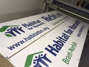Custom vinyl banner displayed outdoors